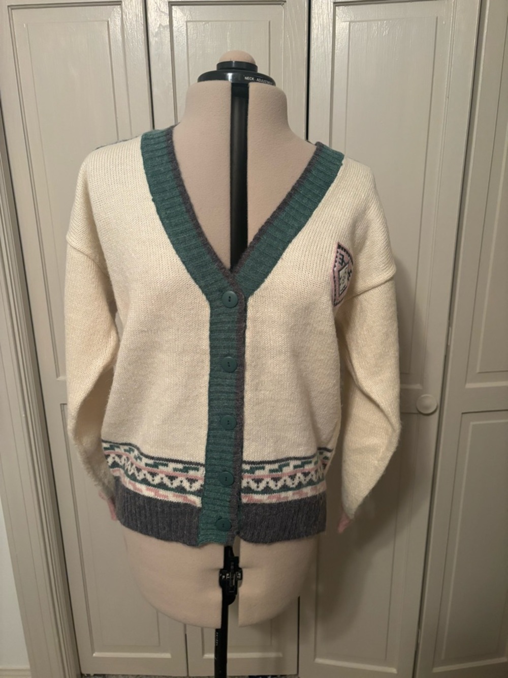 Cream Cardigan with Green Trim and Patterned Hem